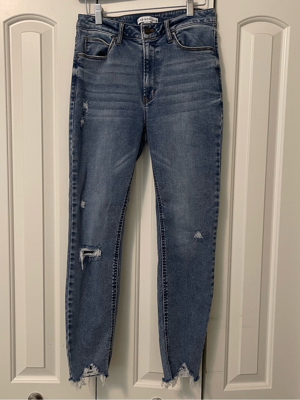 Distressed Mid-Rise Skinny Jeans in Medium Blue